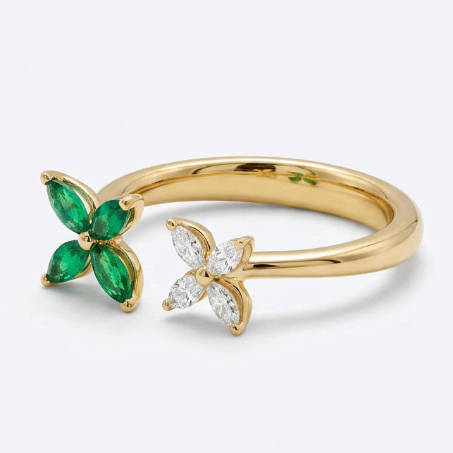 Ogden Of Harrogate 18CT YELLOW GOLD EMERALD AND DIAMOND DOUBLE FLOWER RING.