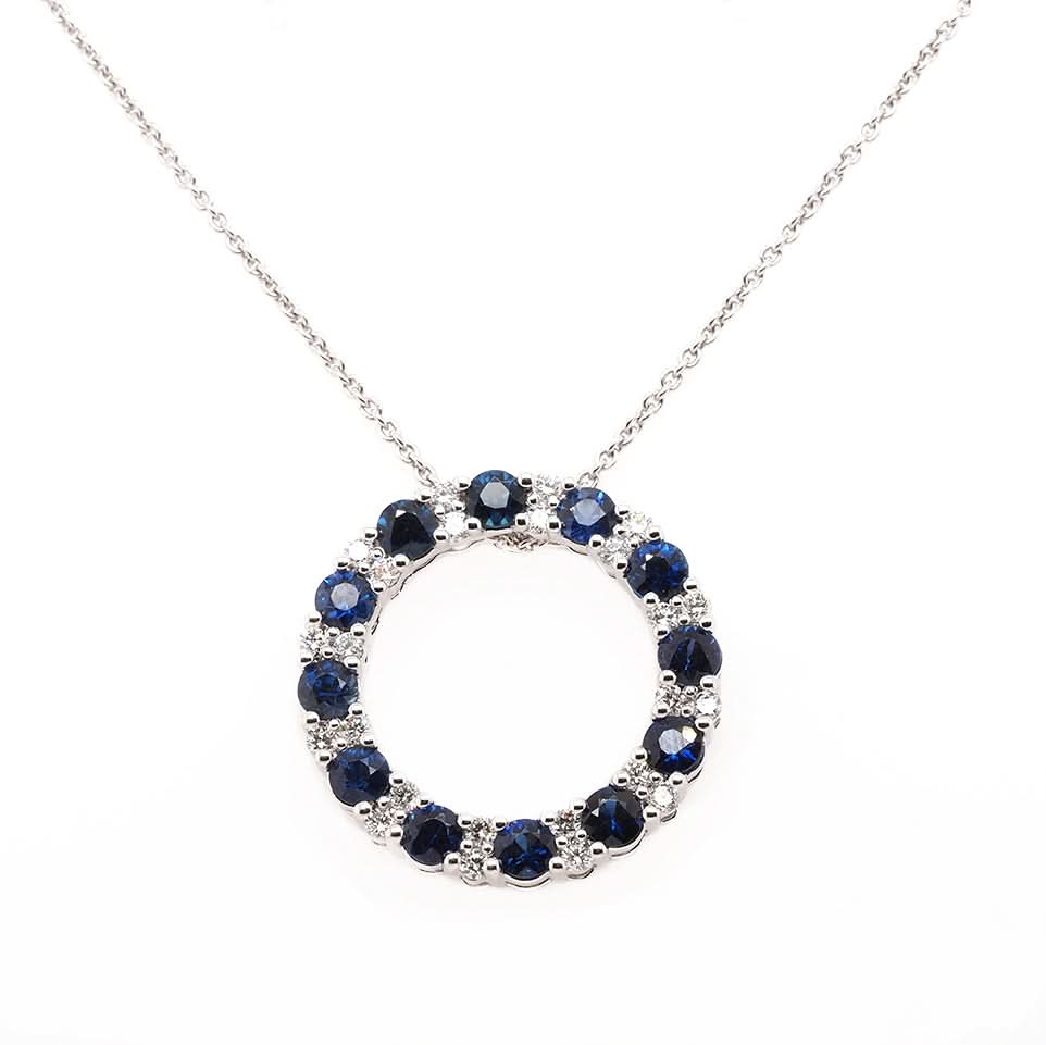 Ogden of Harrogate Jewellery 18ct White Gold Sapphire And Diamond Circular Pendant