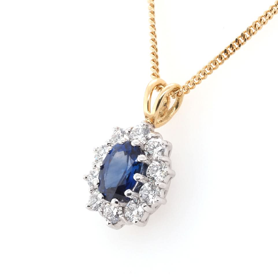 Ogden of Harrogate Jewellery 18ct Yellow Gold Oval Sapphire and Diamond Surround Cluster Pendant on 18ct Yellow Gold Chain