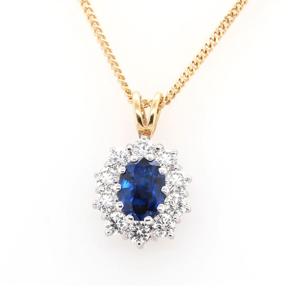 Ogden of Harrogate Jewellery 18ct Yellow Gold Oval Sapphire and Diamond Surround Cluster Pendant on 18ct Yellow Gold Chain