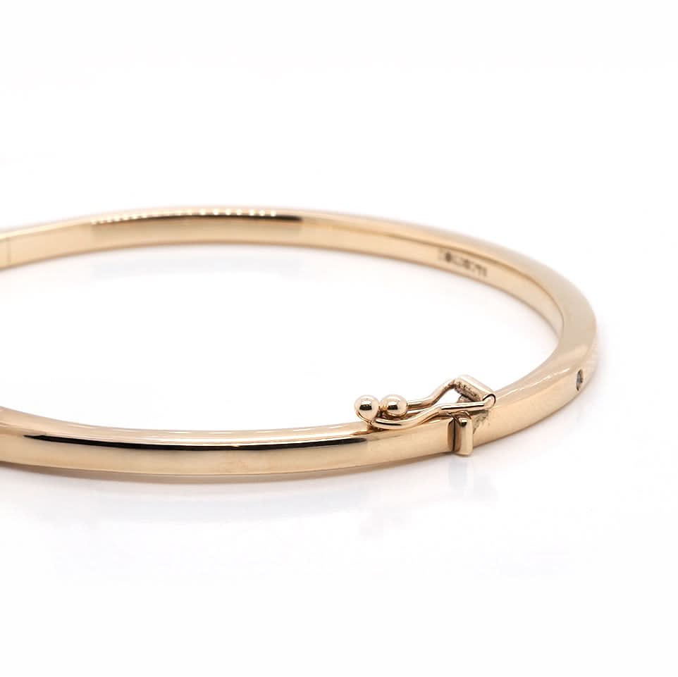 Ogden of Harrogate Jewellery 9ct Yellow Gold Oval Hinged Bangle with Diamonds