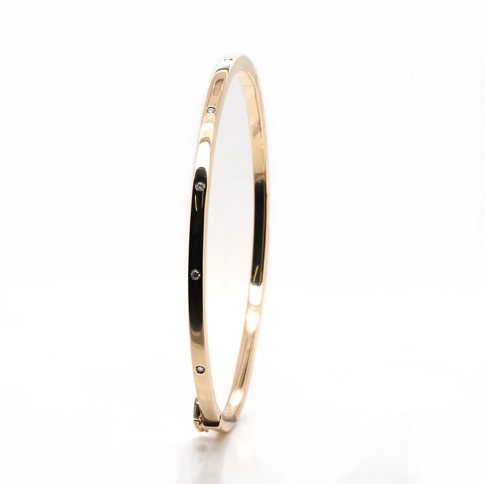 Ogden of Harrogate Jewellery 9ct Yellow Gold Oval Hinged Bangle with Diamonds