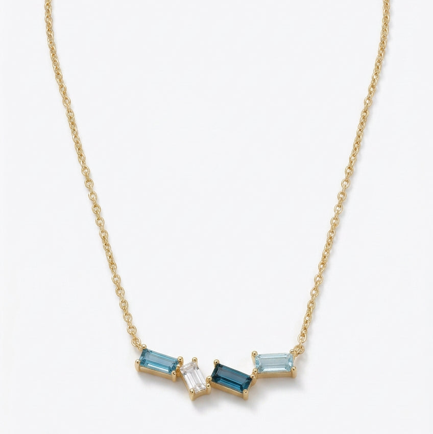 Ogden Of Harrogate Jewellery A Blue Topaz Pendant and Chain in 9ct Yellow Gold, 18 inch chain