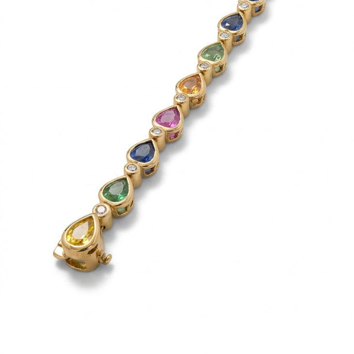 Ogden Of Harrogate Jewellery A Multi Stone Sapphire and Diamond Bracelet in 9ct Yellow Gold