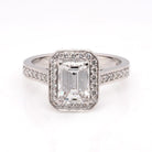 Ogden of Harrogate Jewellery A Platinum and Emerald Cut Diamond Cluster Ring