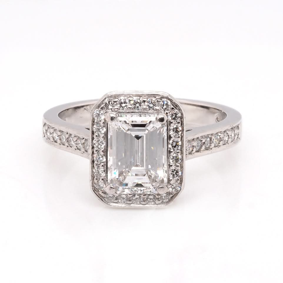 Ogden of Harrogate Jewellery A Platinum and Emerald Cut Diamond Cluster Ring