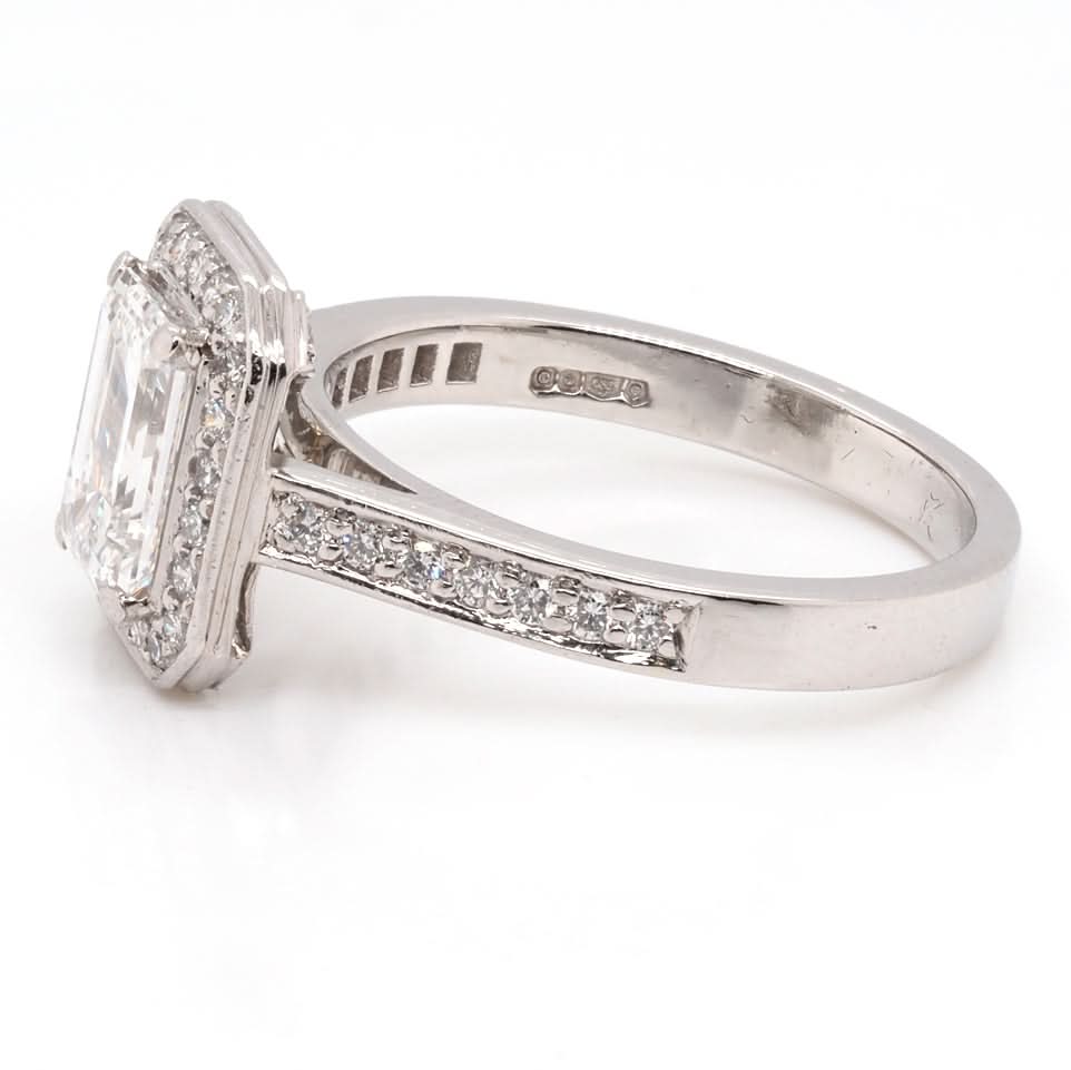 Ogden of Harrogate Jewellery A Platinum and Emerald Cut Diamond Cluster Ring