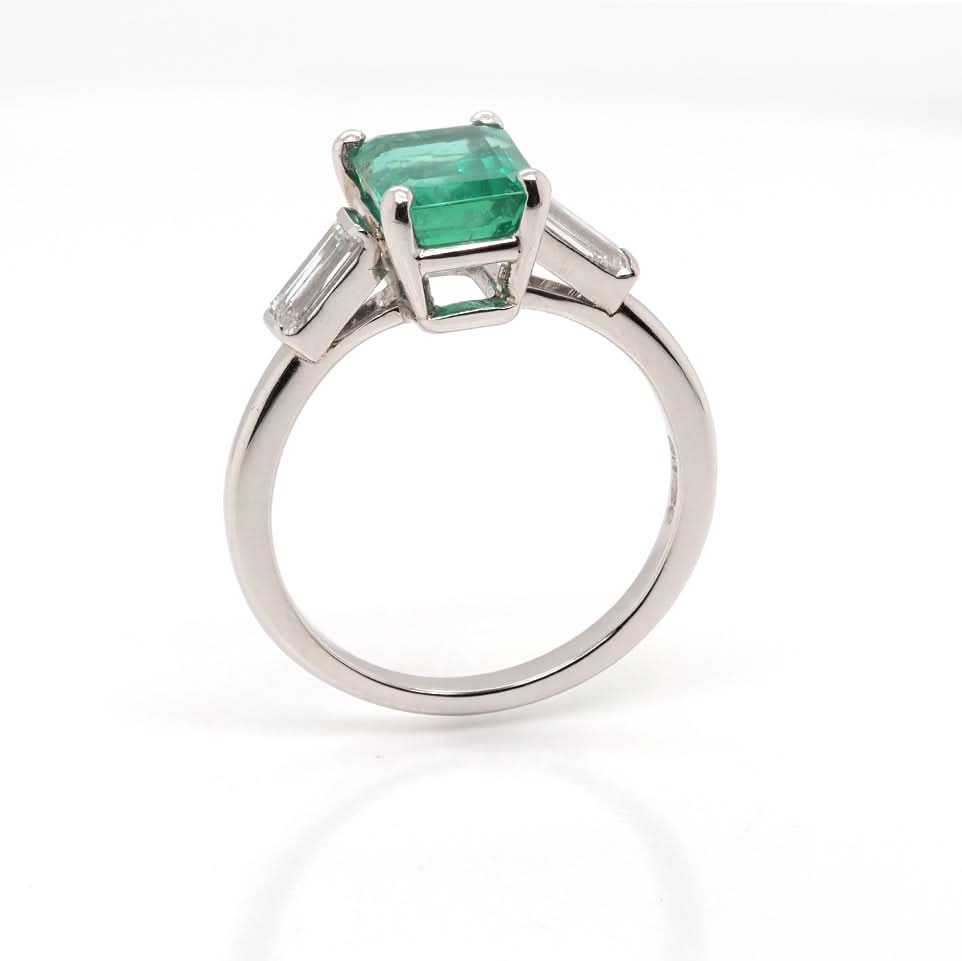 Ogden of Harrogate Jewellery A Platinum, Emerald and Diamond Three Stone Ring
