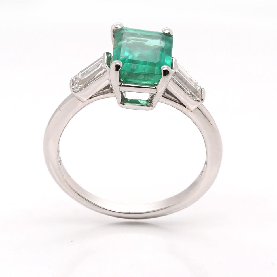 Ogden of Harrogate Jewellery A Platinum, Emerald and Diamond Three Stone Ring