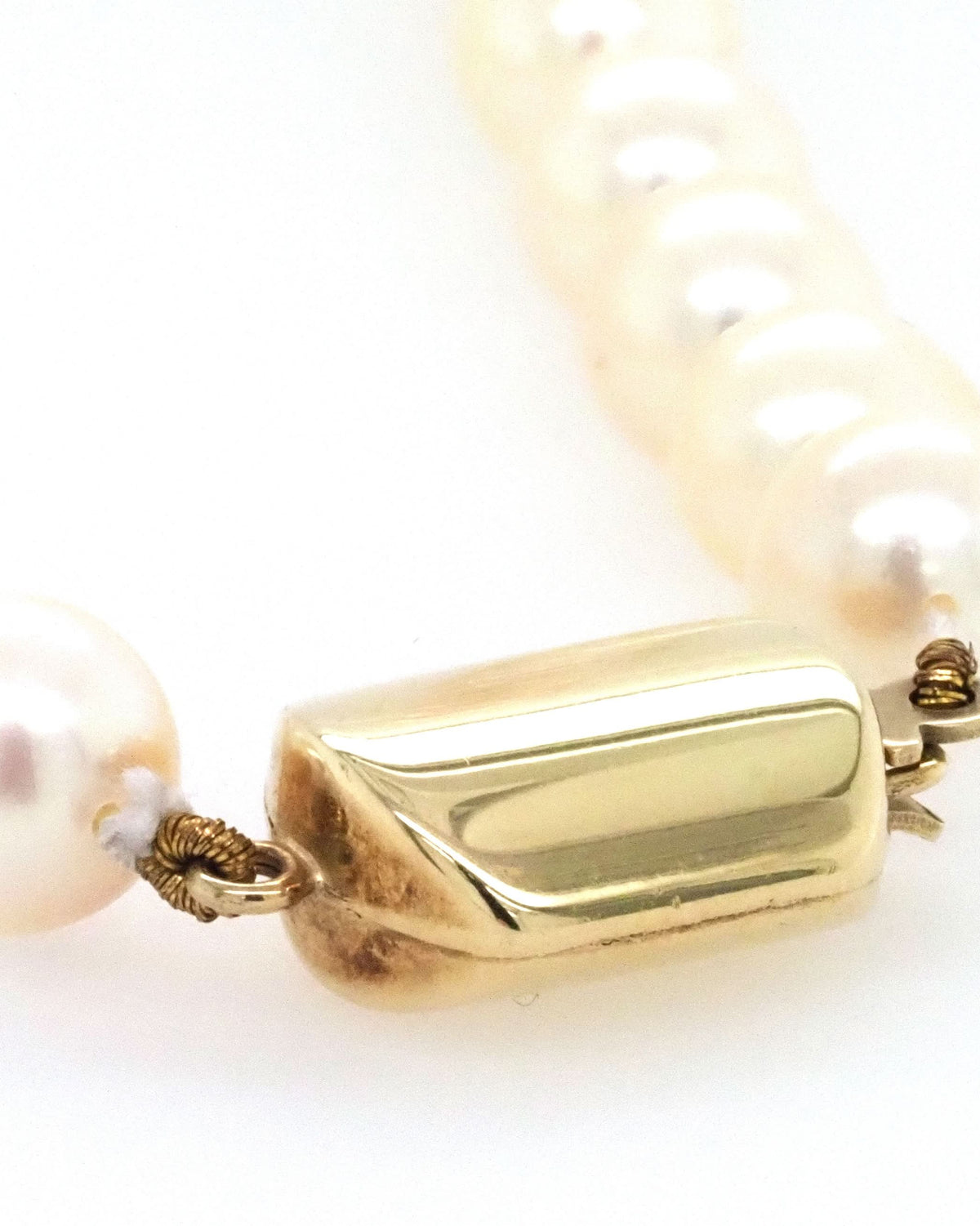 Ogden of Harrogate Jewellery A Row of Cultured Pearls Threaded on an 18ct Yellow Gold Clasp