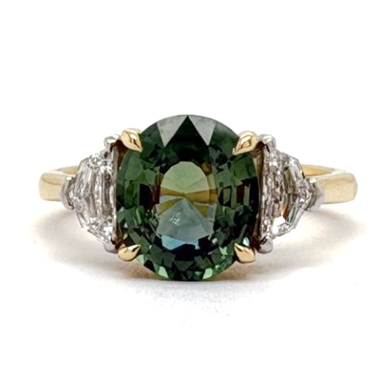 Ogden Of Harrogate Jewellery A Teal Sapphire and Diamond Three-stone Ring,