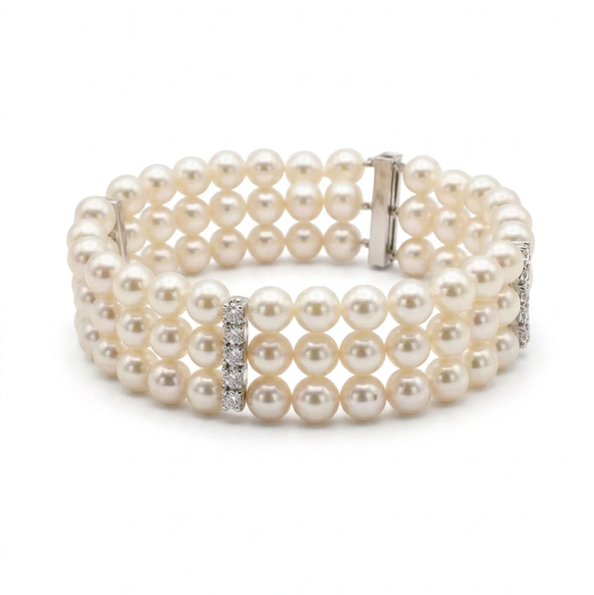 Ogden Of Harrogate Jewellery A Three Row Pearl Bracelet with Three Diamond Set Spacers