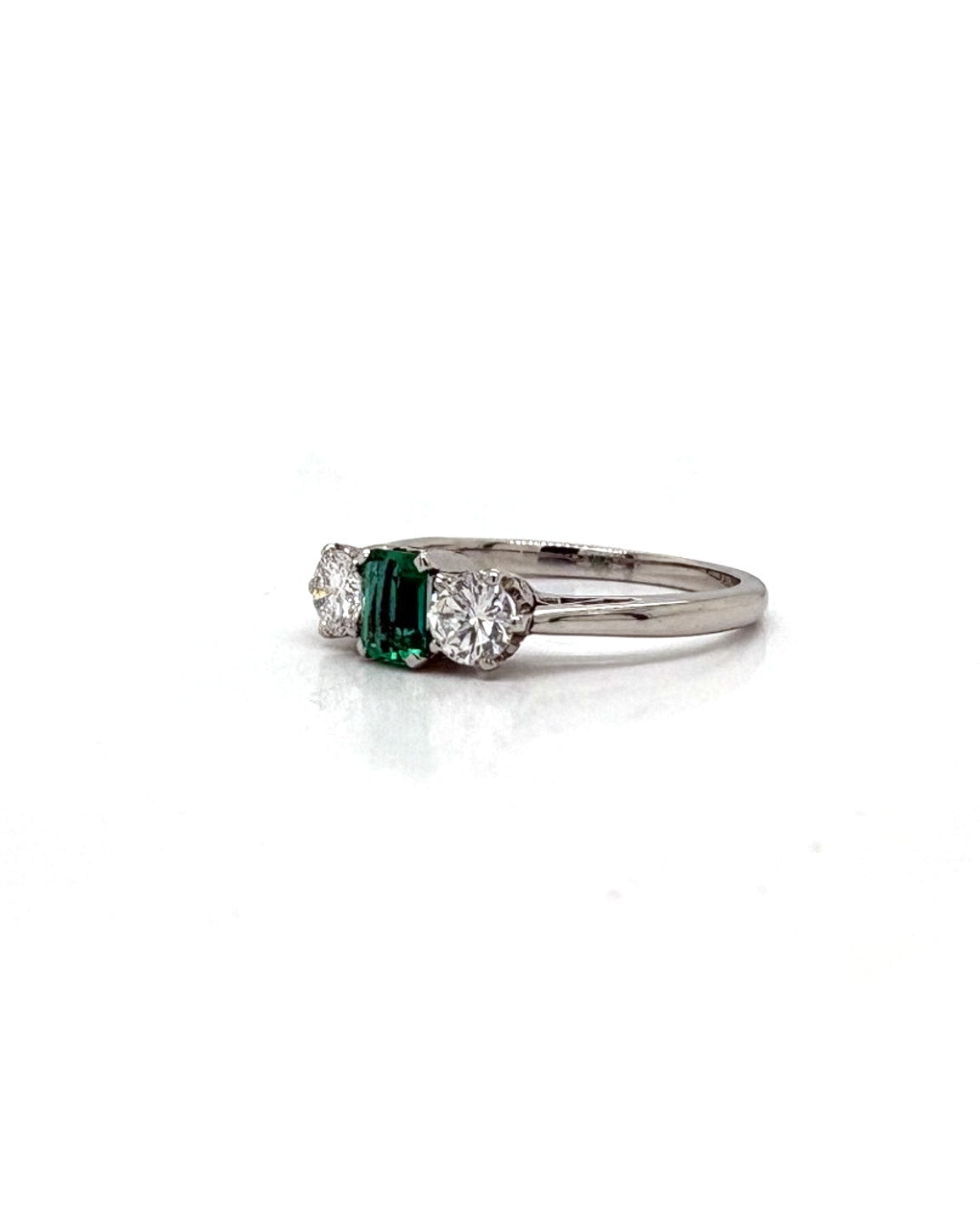 Ogden Of Harrogate Jewellery An Emerald and Diamond Three-stone Ring