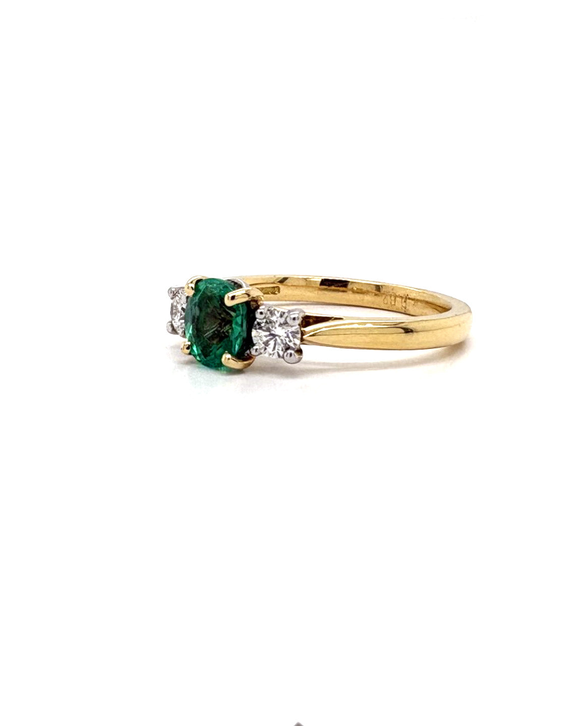 Ogden Of Harrogate Jewellery An Emerald and Diamond Three-stone Ring