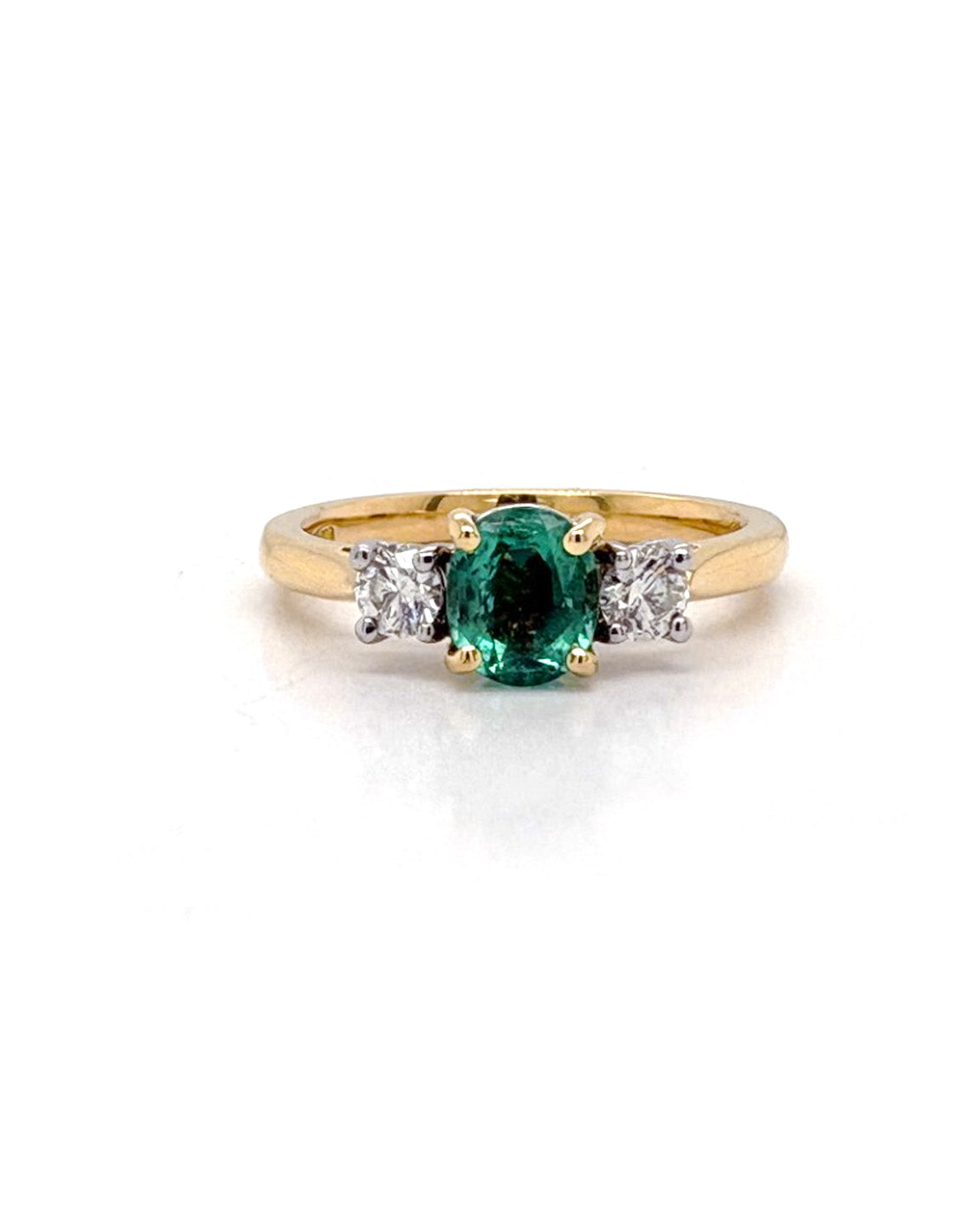Ogden Of Harrogate Jewellery An Emerald and Diamond Three-stone Ring