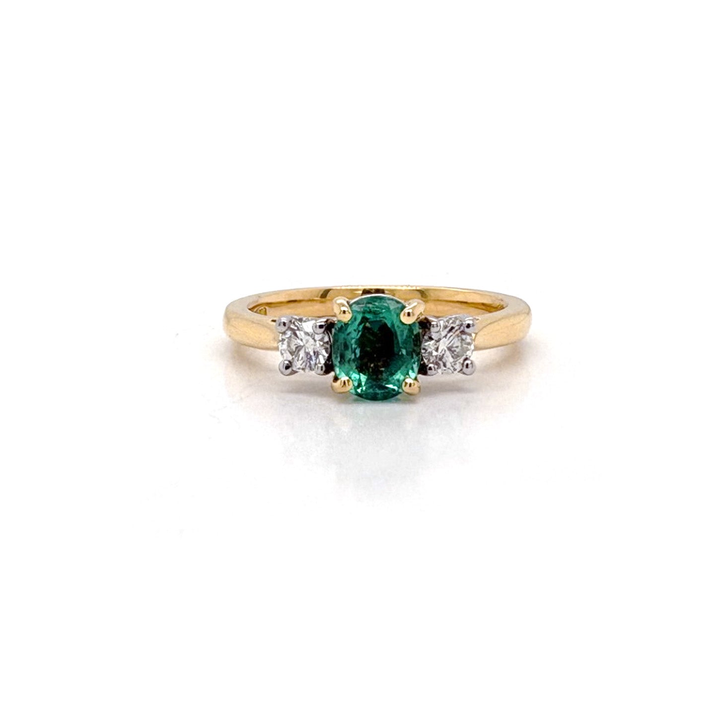 Ogden Of Harrogate Jewellery An Emerald and Diamond Three-stone Ring