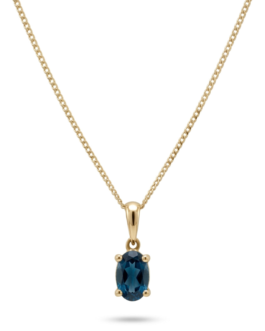 Ogden Of Harrogate Jewellery Oval london Blue Topaz Claw Set Pendant with Chain in 9ct Yellow Gold