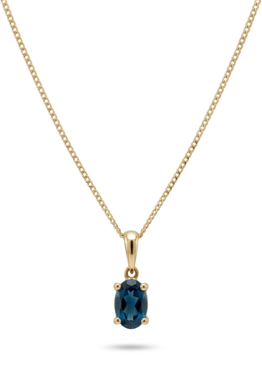 Ogden Of Harrogate Jewellery Oval london Blue Topaz Claw Set Pendant with Chain in 9ct Yellow Gold
