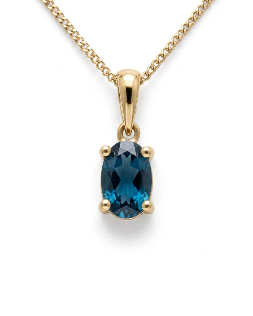 Ogden Of Harrogate Jewellery Oval london Blue Topaz Claw Set Pendant with Chain in 9ct Yellow Gold