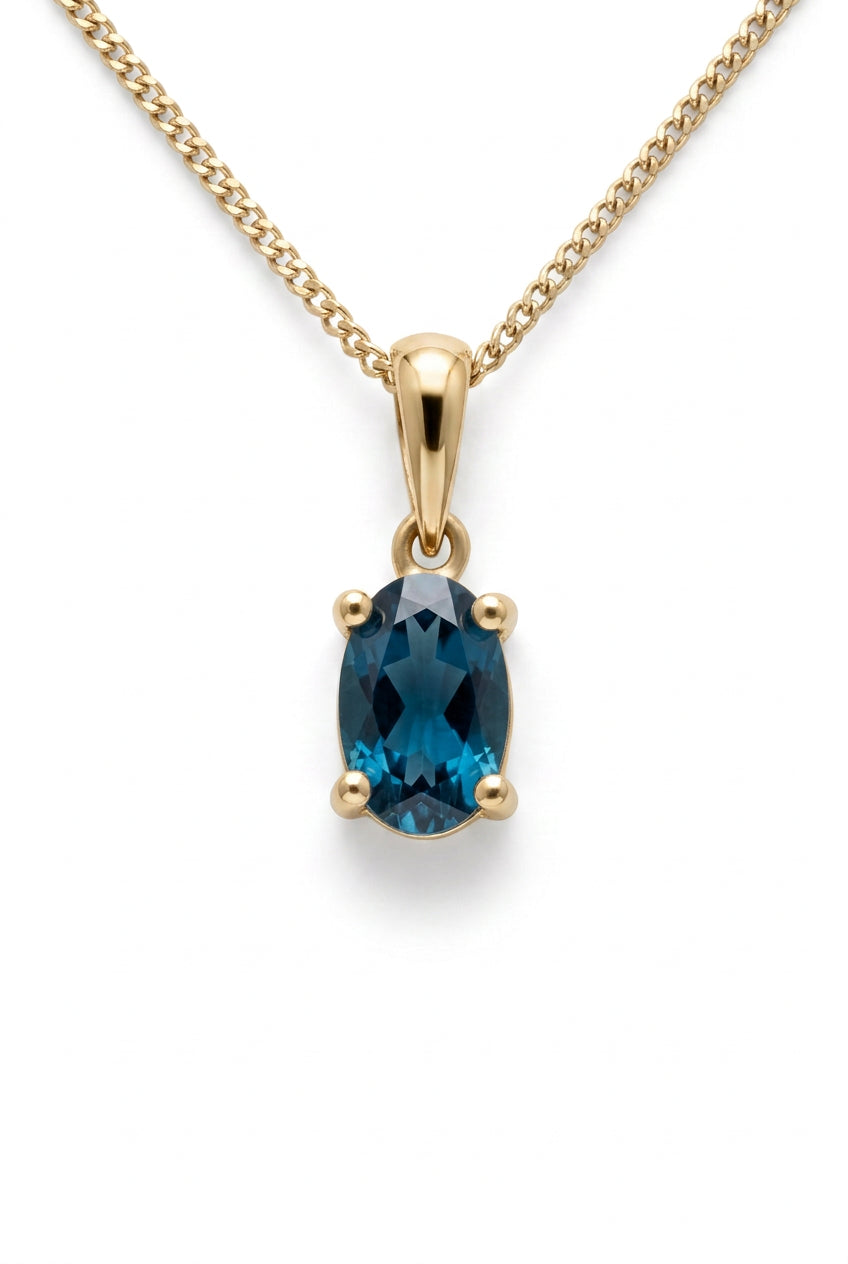 Ogden Of Harrogate Jewellery Oval london Blue Topaz Claw Set Pendant with Chain in 9ct Yellow Gold