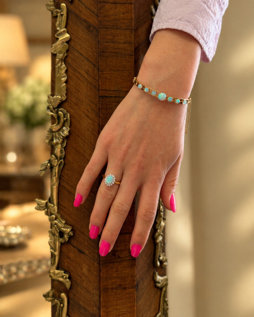 Ogden Of Harrogate Jewellery Oval Opal and Diamond Cluster Ring in 18ct Yellow Gold