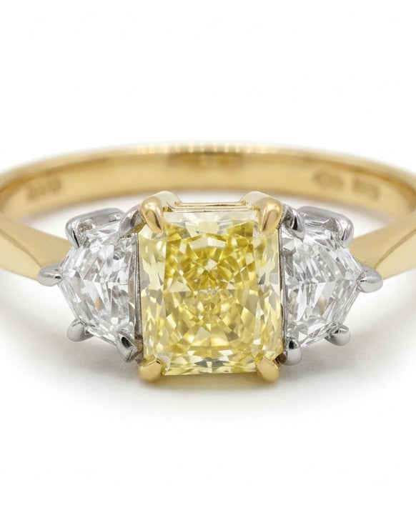 Ogden Of Harrogate Vintage Jewellery A Fancy Yellow Diamond Three Stone Ring in 18ct Yellow and White Gold