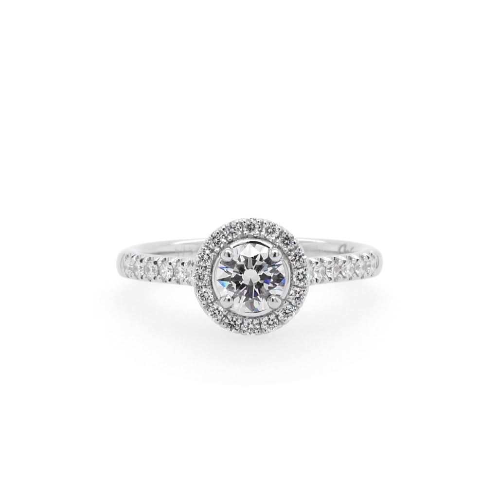 Ogden of Harrogate Jewellery A Platinum Brilliant-Cut Diamond Cluster Ring with Diamond Shoulders