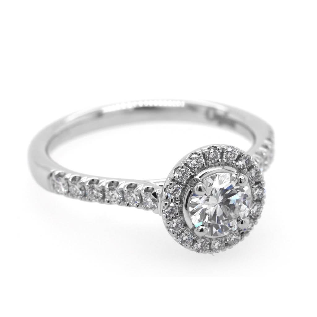 Ogden of Harrogate Jewellery A Platinum Brilliant-Cut Diamond Cluster Ring with Diamond Shoulders