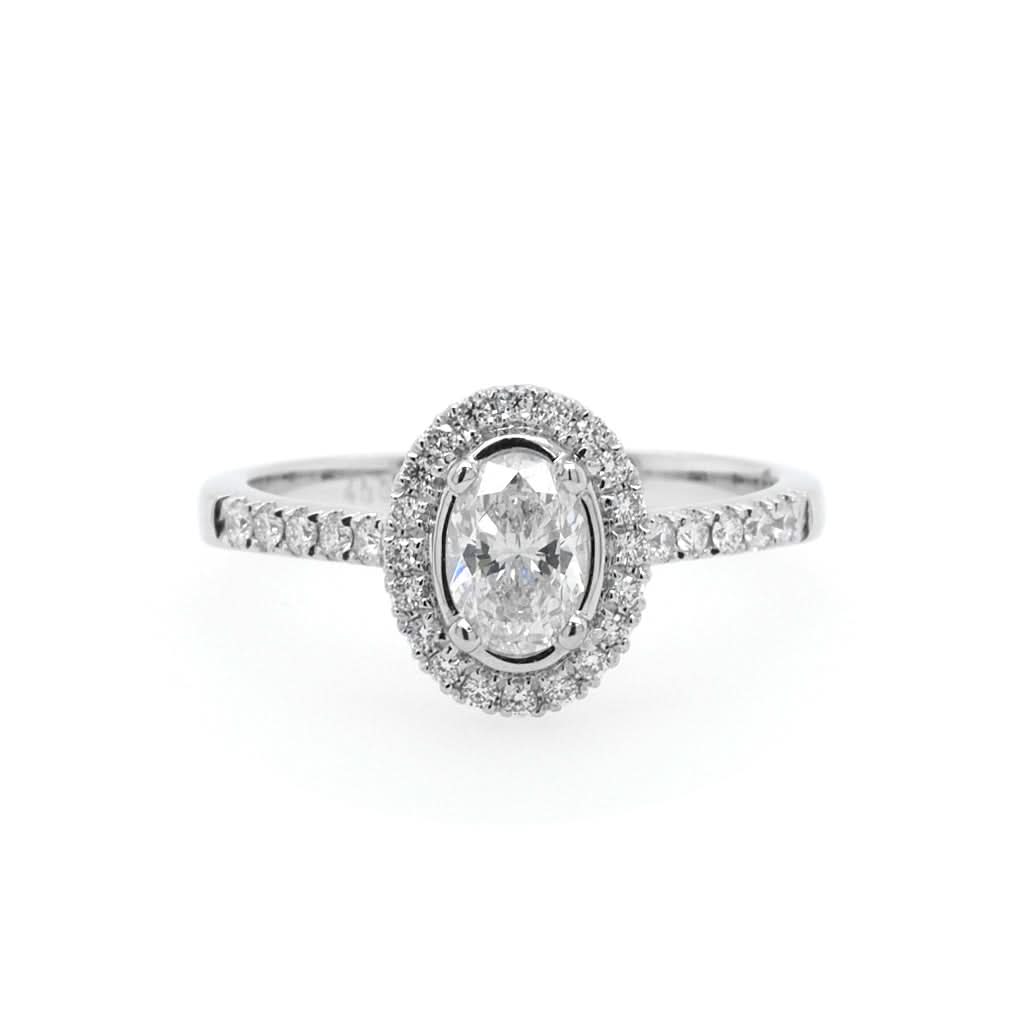 Ogden of Harrogate Jewellery A Platinum Oval Diamond Cluster Ring with Diamond Shoulders
