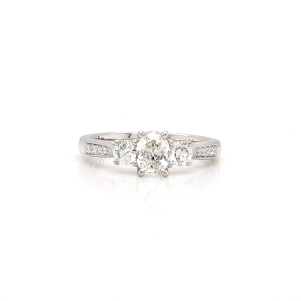 Ogden of Harrogate Jewellery A Platinum Three-Stone Diamond Ring with Diamond-set Shoulders