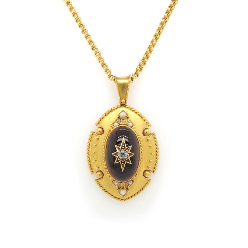 Ogden of Harrogate Jewellery A Victorian Ornate Cabochon Garnet and Gold Pendant, c.1880