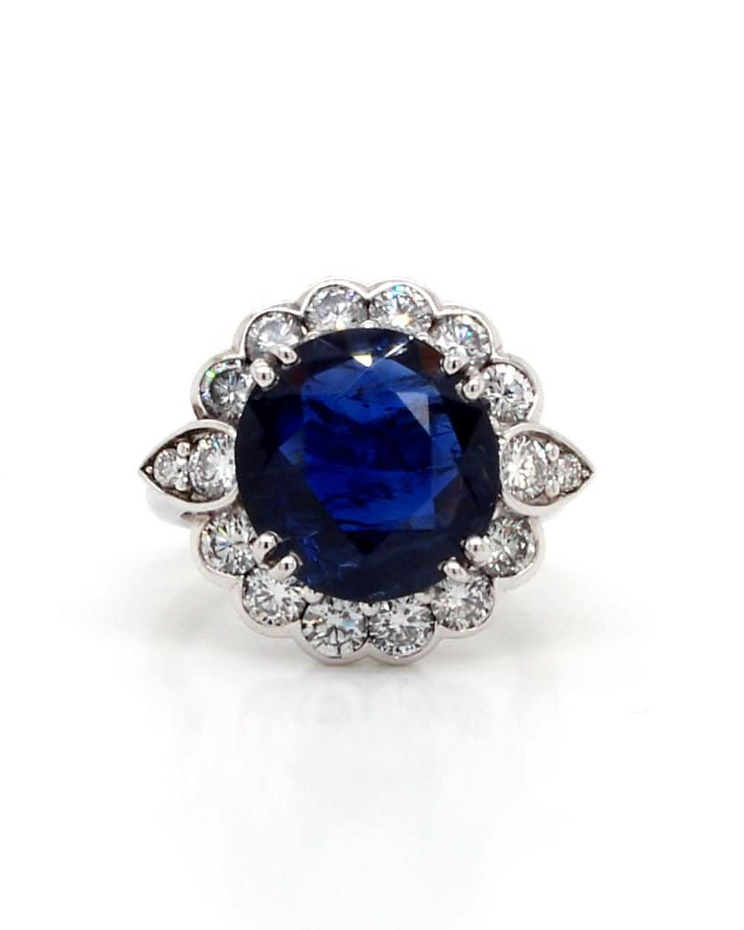Ogden of Harrogate Jewellery An 18ct Gold Burmese Sapphire and Diamond Cluster Ring