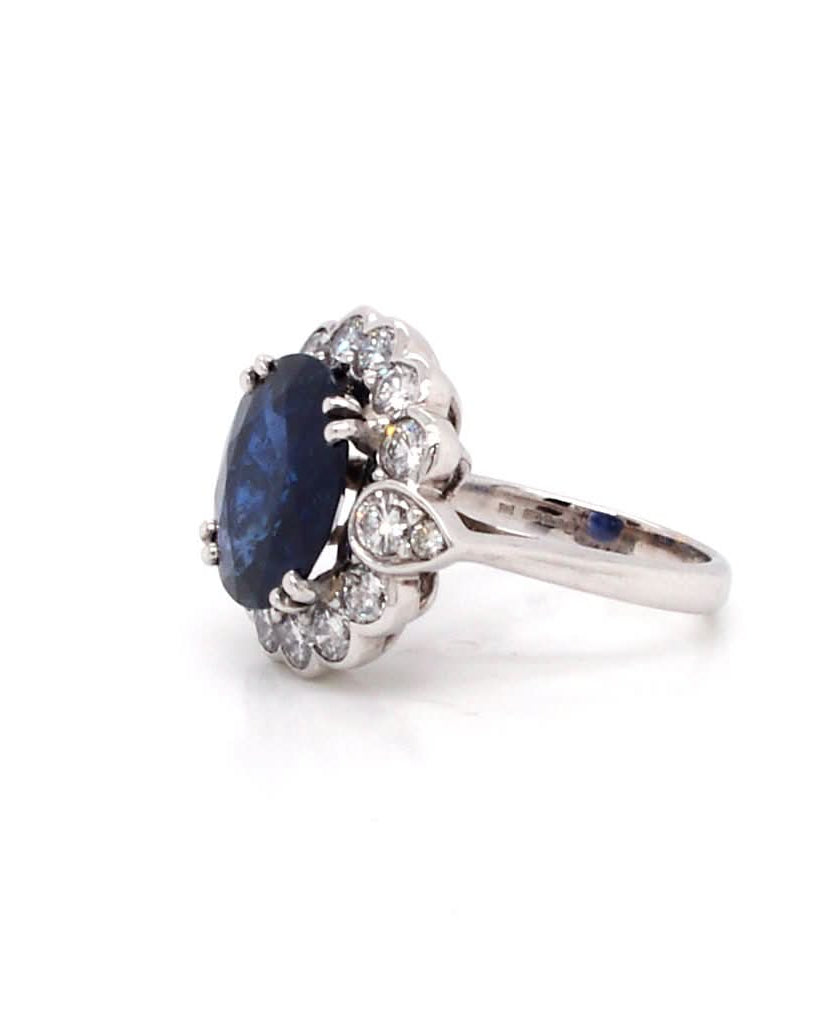 Ogden of Harrogate Jewellery An 18ct Gold Burmese Sapphire and Diamond Cluster Ring