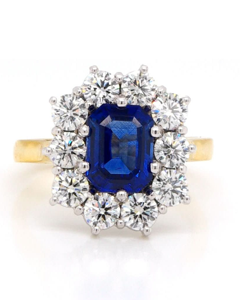 Ogden of Harrogate Jewellery An 18ct Gold Sapphire and Diamond Cluster Ring