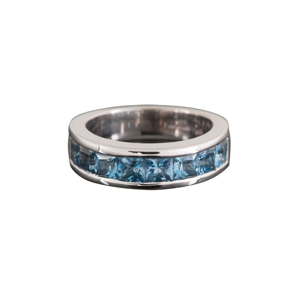 Ogden of Harrogate Jewellery An 18ct white gold and channel-set square aquamarine ring.