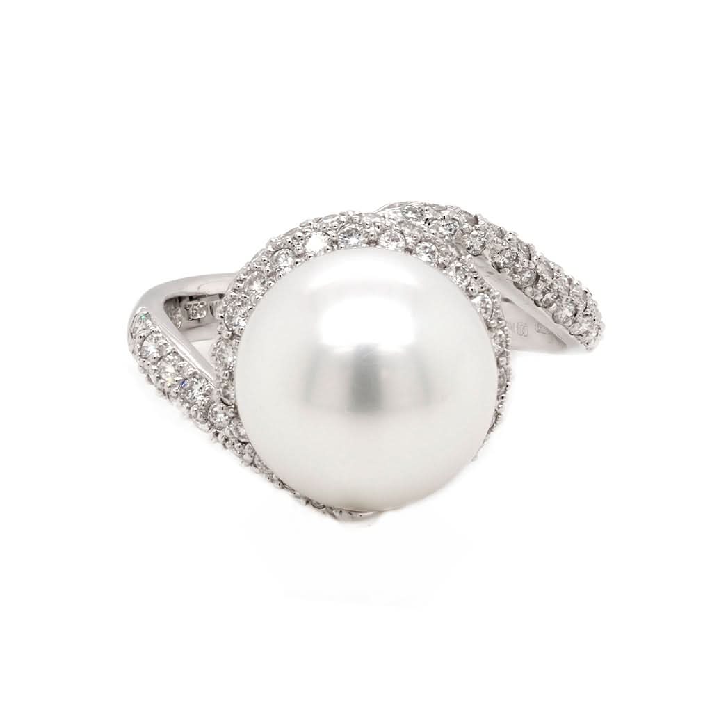 Ogden of Harrogate Jewellery An 18ct white gold, pearl and diamond swirl ring by Mikimoto