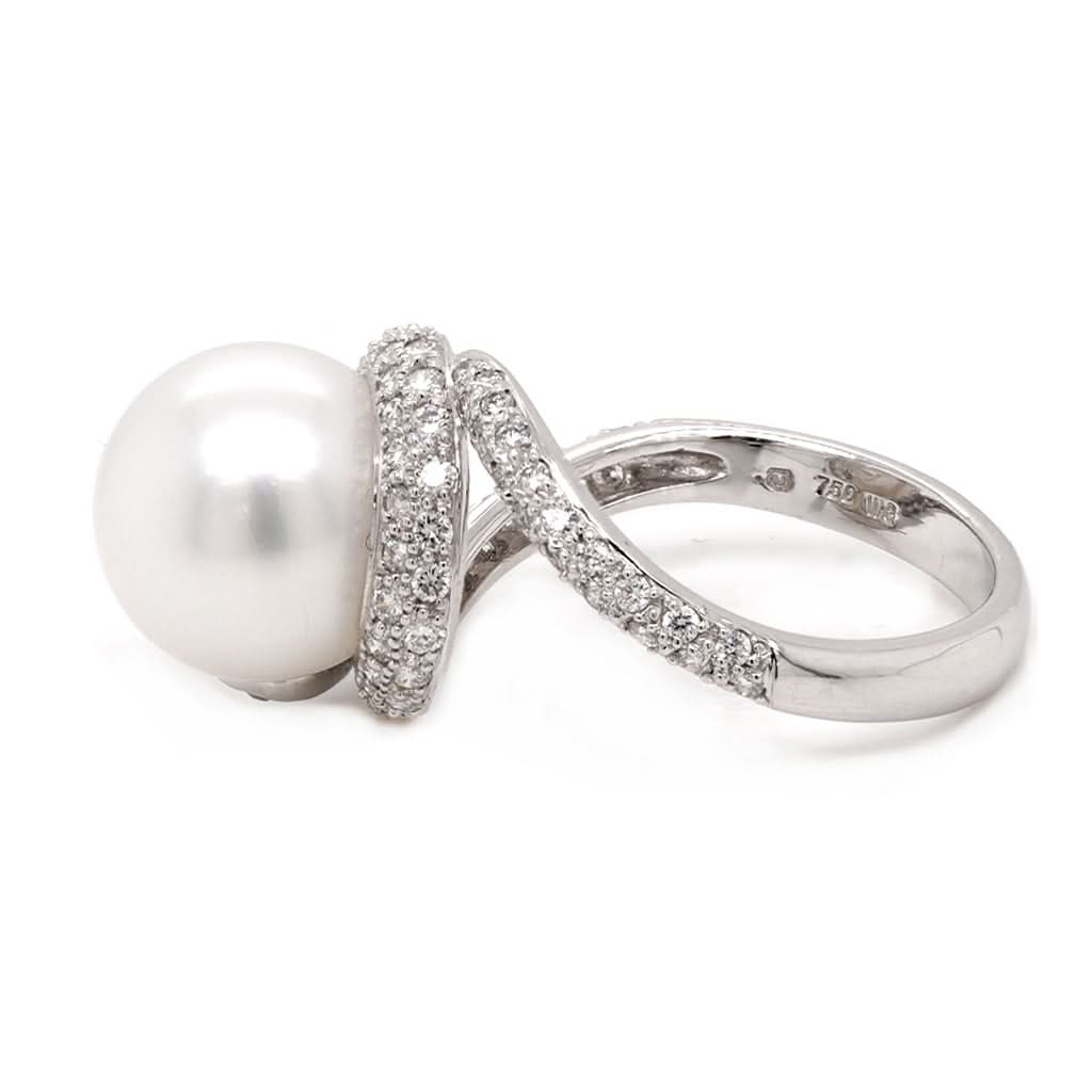 Ogden of Harrogate Jewellery An 18ct white gold, pearl and diamond swirl ring by Mikimoto