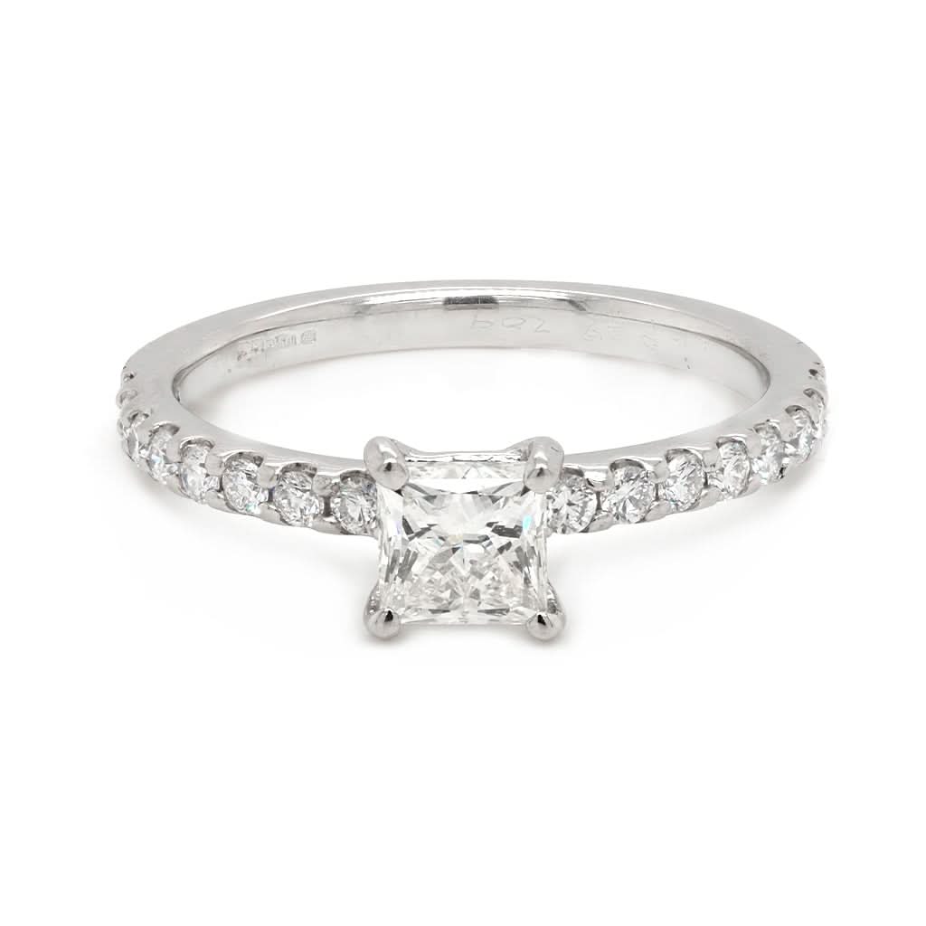 Ogden of Harrogate Jewellery An 18ct white gold princess cut diamond ring with brilliant cut diamond-set shoulders 0.70cts