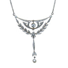 Ogden of Harrogate Jewellery An Edwardian 15ct gold, platinum, diamond and pearl floral drop pendant on curb chain