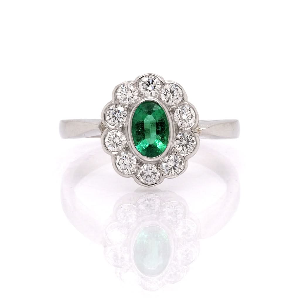 Ogden of Harrogate Jewellery Platinum, Oval Emerald and Diamond Cluster Ring, emerald 0.37cts, diamond 0.40cts