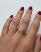 Ogden Of Harrogate 18CT YELLOW GOLD EMERALD AND DIAMOND DOUBLE FLOWER RING.