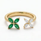 Ogden Of Harrogate 18CT YELLOW GOLD EMERALD AND DIAMOND DOUBLE FLOWER RING.