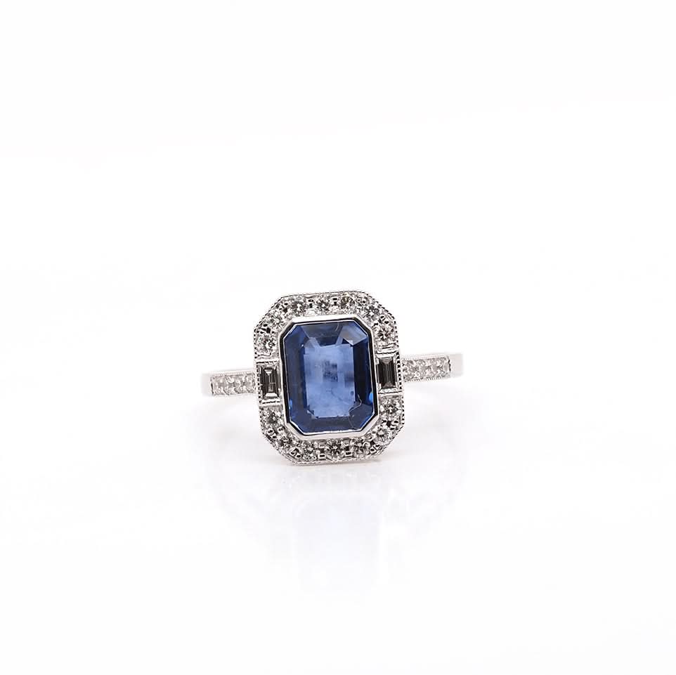 Ogden of Harrogate Jewellery 18ct White Gold Emerald-Cut Sapphire and Diamond Cluster Ring with Diamond Set Shoulders