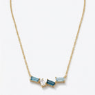Ogden Of Harrogate Jewellery A Blue Topaz Pendant and Chain in 9ct Yellow Gold, 18 inch chain
