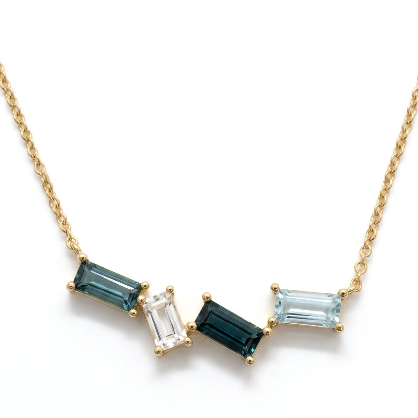 Ogden Of Harrogate Jewellery A Blue Topaz Pendant and Chain in 9ct Yellow Gold, 18 inch chain