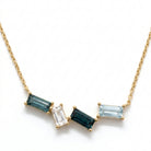 Ogden Of Harrogate Jewellery A Blue Topaz Pendant and Chain in 9ct Yellow Gold, 18 inch chain