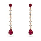 Ogden Of Harrogate Jewellery A Pair of 18ct Rose Gold Ruby and Diamond Drop Earrings.