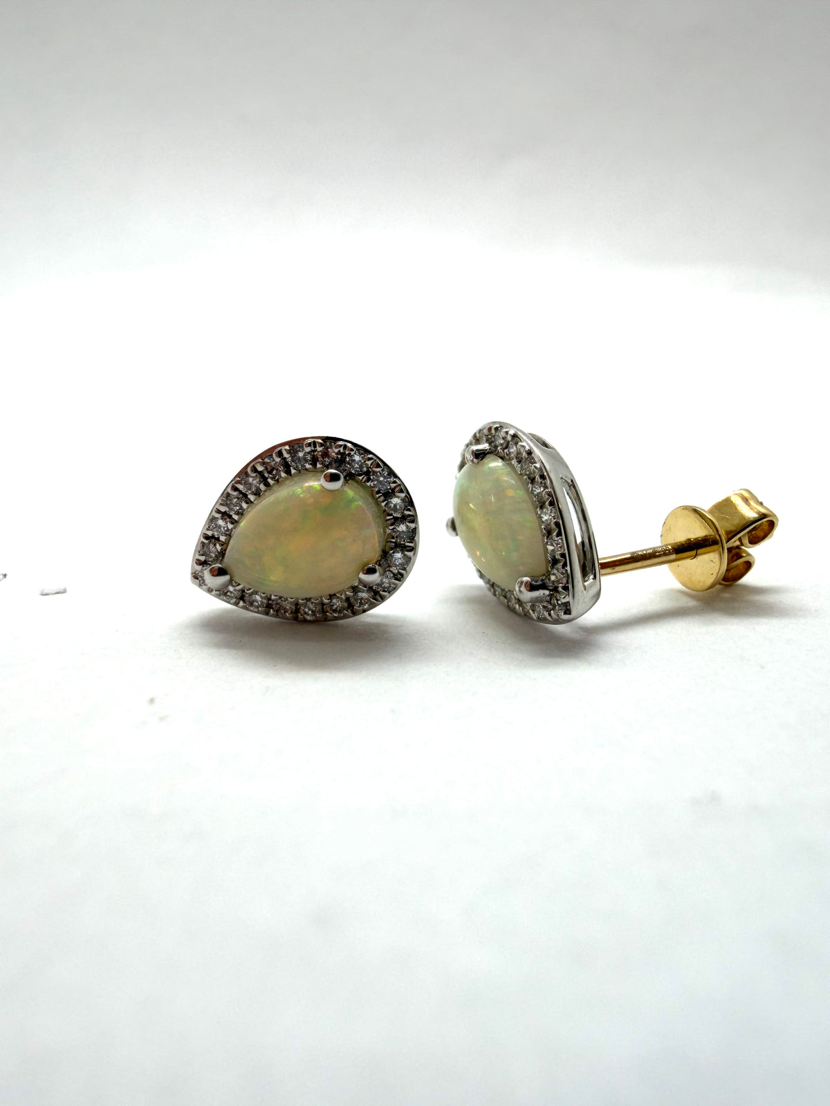 Ogden Of Harrogate Jewellery A Pair of Opal and Diamond Pear Shaped Earrings in 18ct White Gold