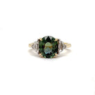 Ogden Of Harrogate Jewellery A Teal Sapphire and Diamond Three-stone Ring,
