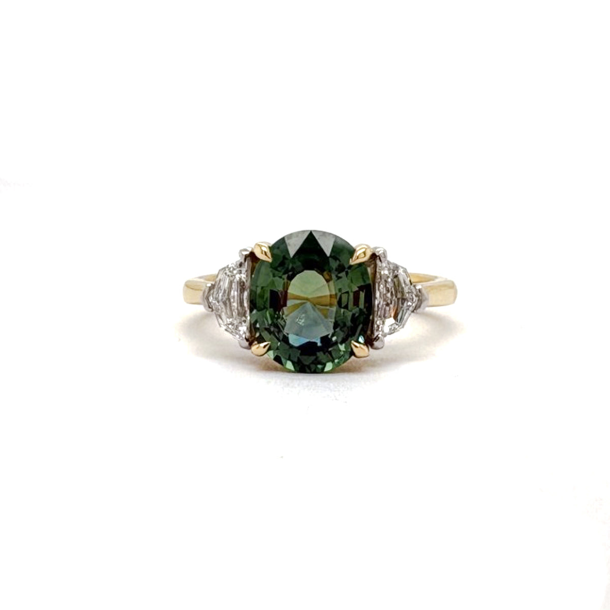 Ogden Of Harrogate Jewellery A Teal Sapphire and Diamond Three-stone Ring,